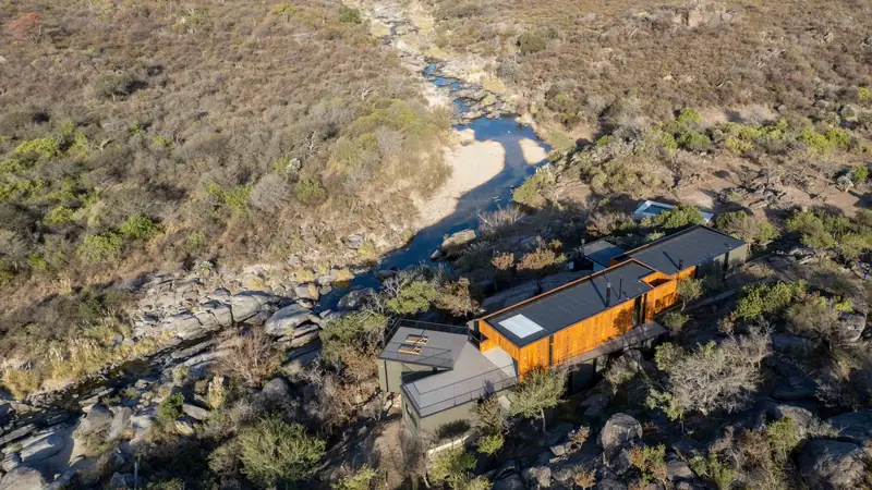 Aerial view of Casa en Piedras above a river canyon