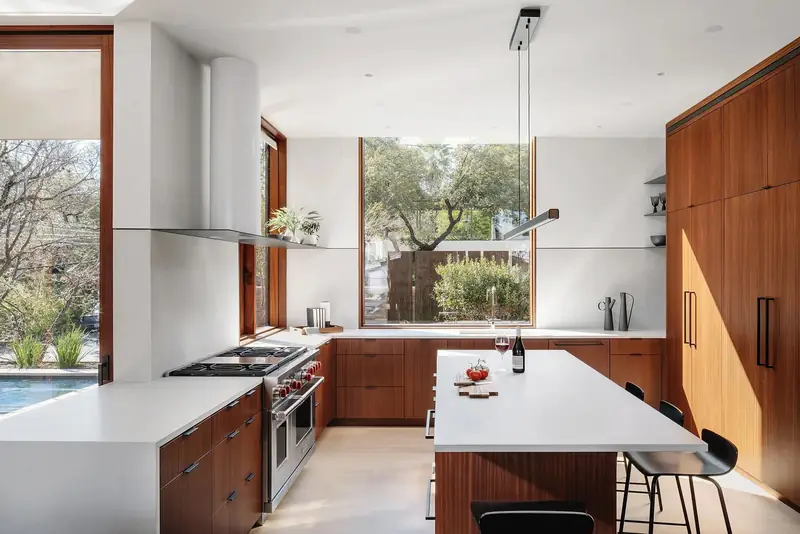 Kitchen with wood cabinets and white island, Casa Retama
