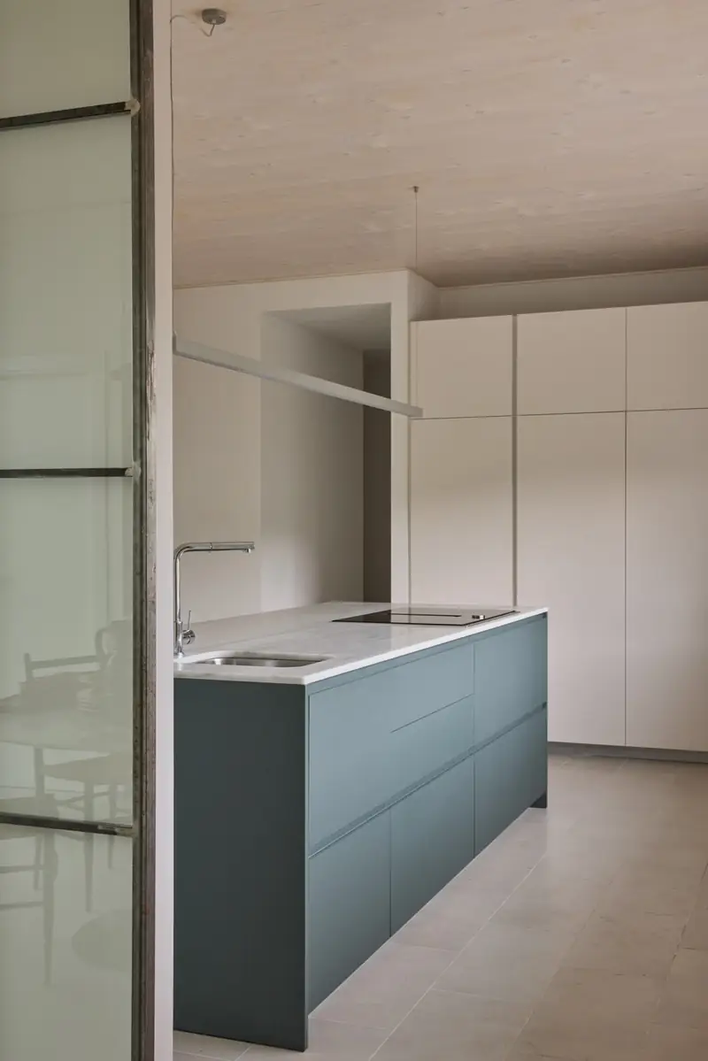 Kitchen with blue-gray cabinetry, La Jungla