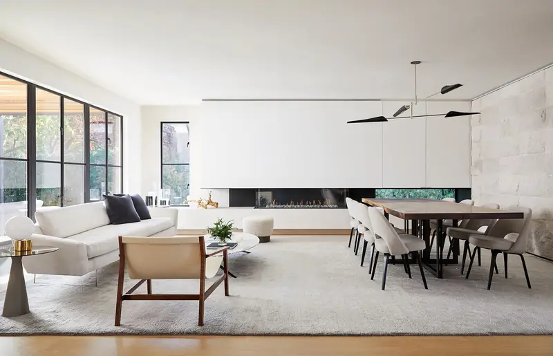 Open living and dining room with large windows, Stone Haven